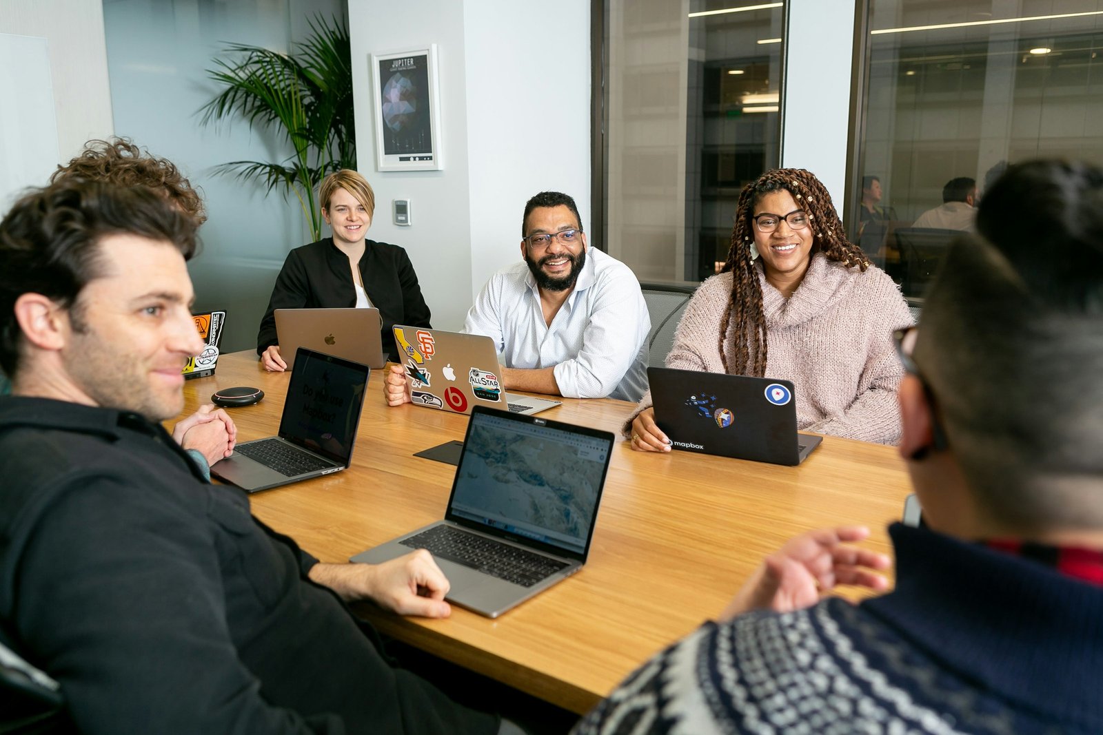 A marketing team from mixed backgrounds working together around a table